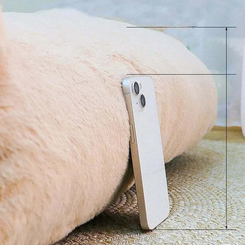 Soft plush cat bed sofa with a smartphone resting against it, showcasing comfort and style for pets.