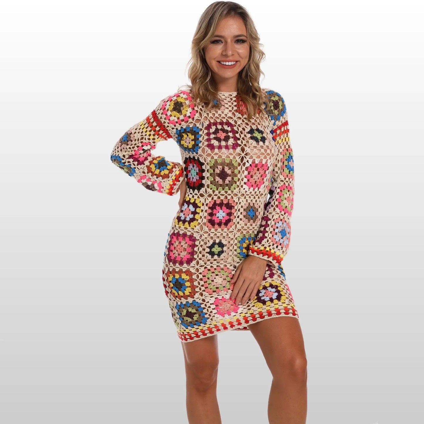 Model wearing a handmade boho crochet dress with colorful granny squares, perfect for beach weddings or summer vacations.