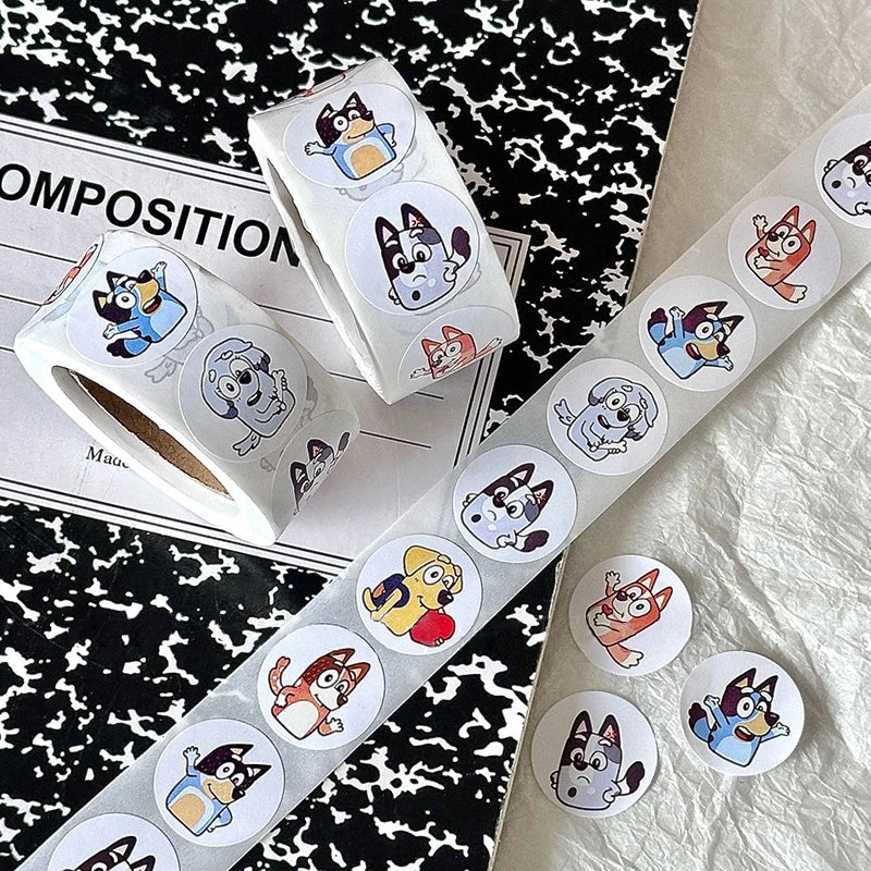 Roll of 500 Bluey and Bingo dog stickers on paper, perfect for kids' crafts and decorating projects.
