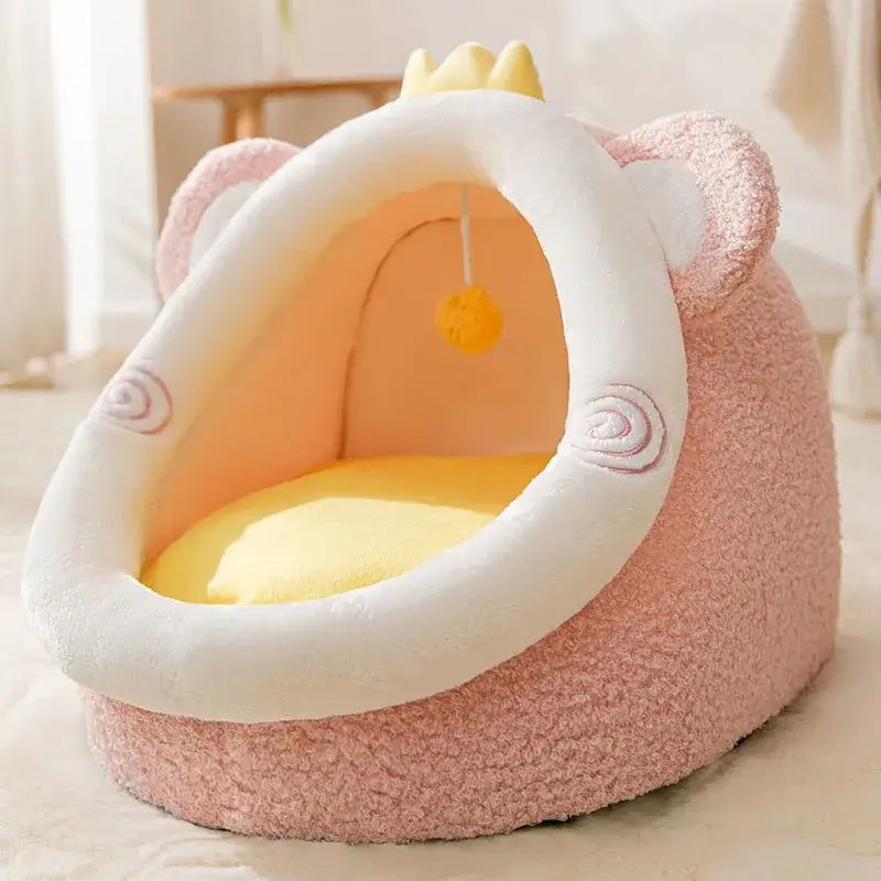 Foldable pet house with cozy pink design, featuring a soft entrance and playful pom-pom, perfect for small animals.