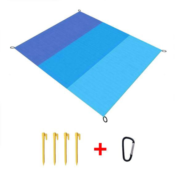 Large blue sand-proof beach blanket with four securing nails and carabiner, ideal for camping and hiking