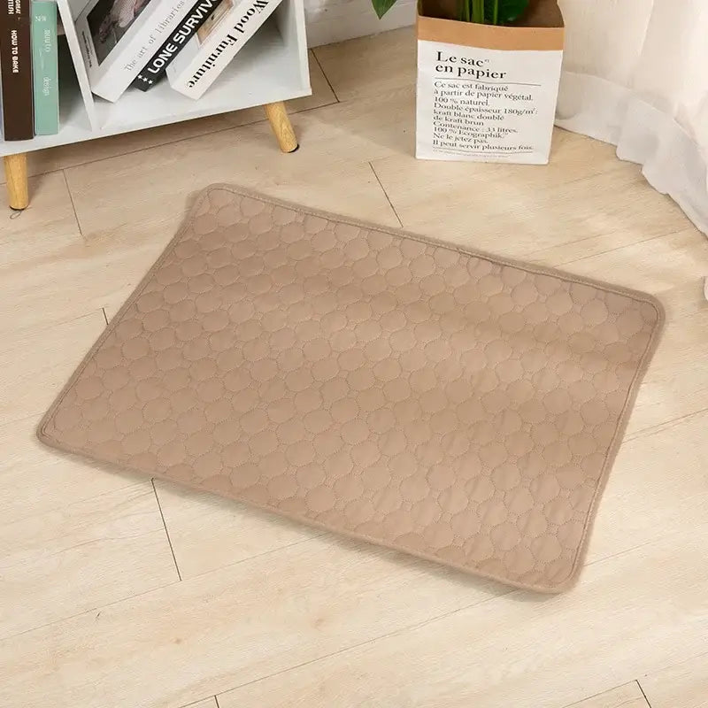 Quilted dog cooling mat on wooden floor, ideal for keeping pets cool and comfortable during hot weather.