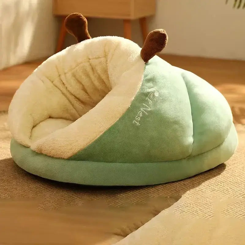 Cozy green cat nest shaped like a slipper, perfect for small pets to snuggle and rest comfortably.