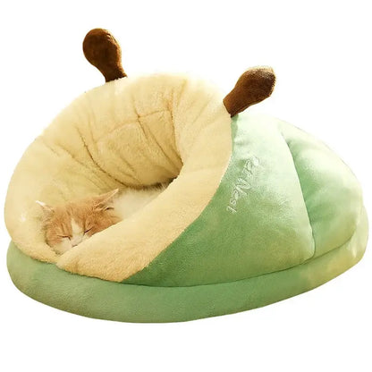 Cozy cat resting in a green slipper-shaped pet bed, perfect for small dogs and cats, offering warmth and comfort.